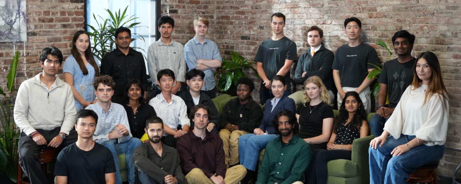 Vals AI team in a brick-walled San Francisco office