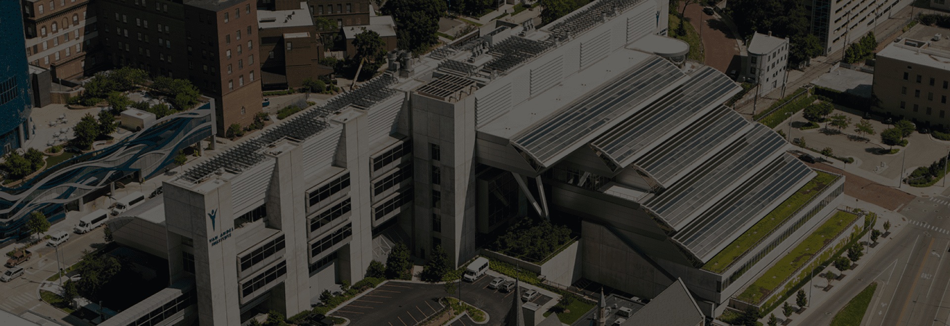 Aerial view of Van Andel Institute’s stepped building and glass roof in Grand Rapids