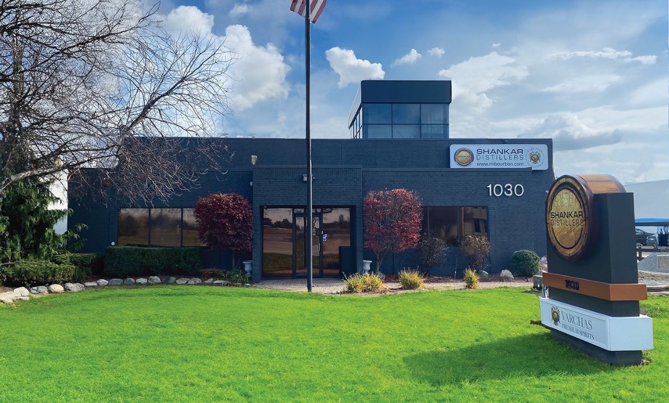 The exterior of Shankar Distillers in Troy, Michigan, with its roadside barrel-shaped sign