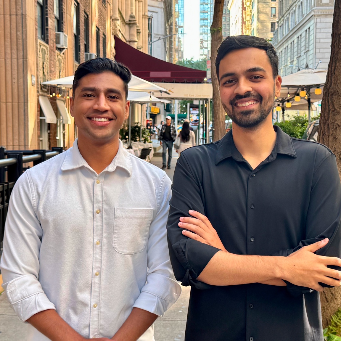 Varun Krishnamurthy, left, and Assured co-founder Rahul Shivkumar standing together outdoors