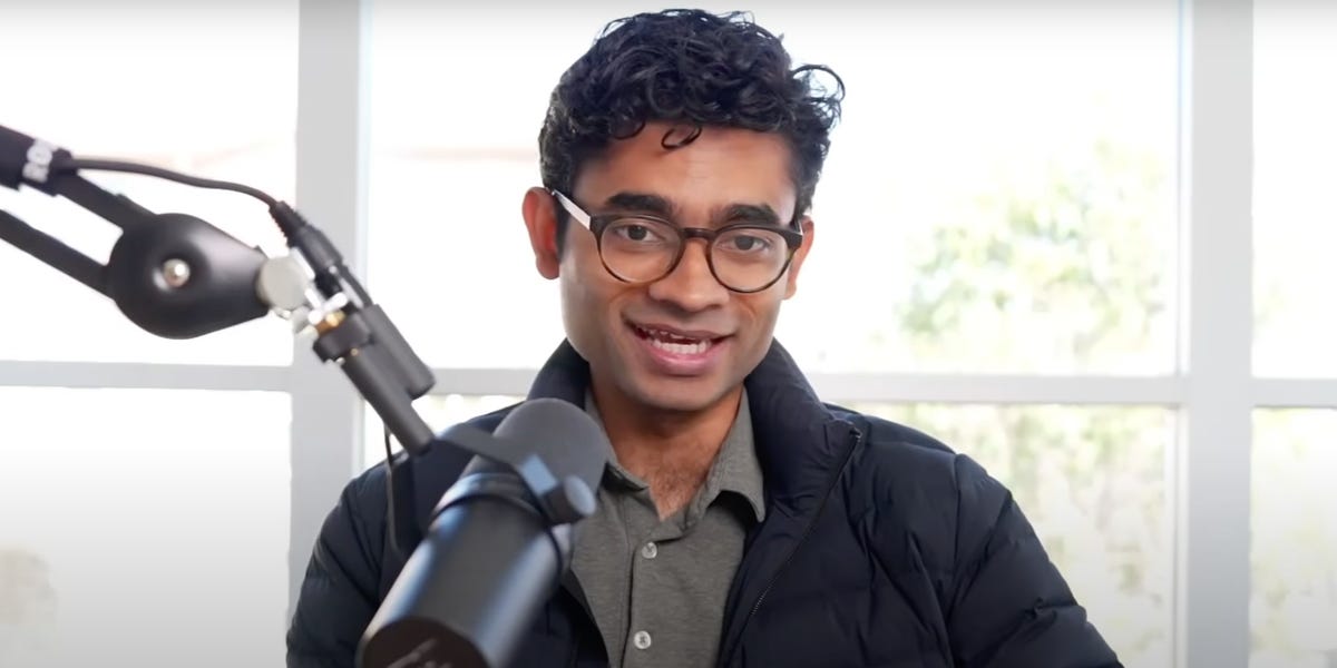 Varun Mohan speaking into a microphone during a 2025 interview