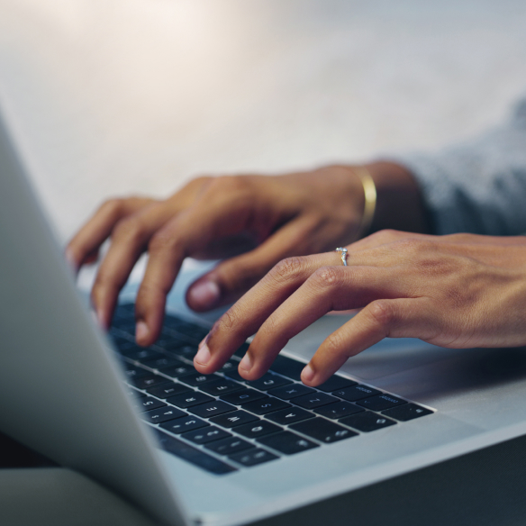 Hands typing on a laptop, an illustrative photograph from Vatica’s website