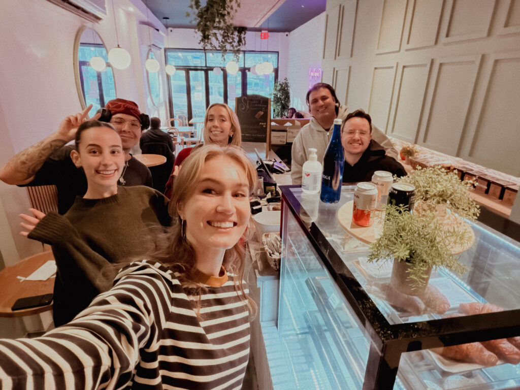 VaynerSpeakers collaborators gathering around a cafe counter during the Kofee campaign