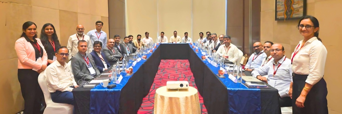 Participants gathered around a U-shaped table at Vegam PartnerConnect 2025