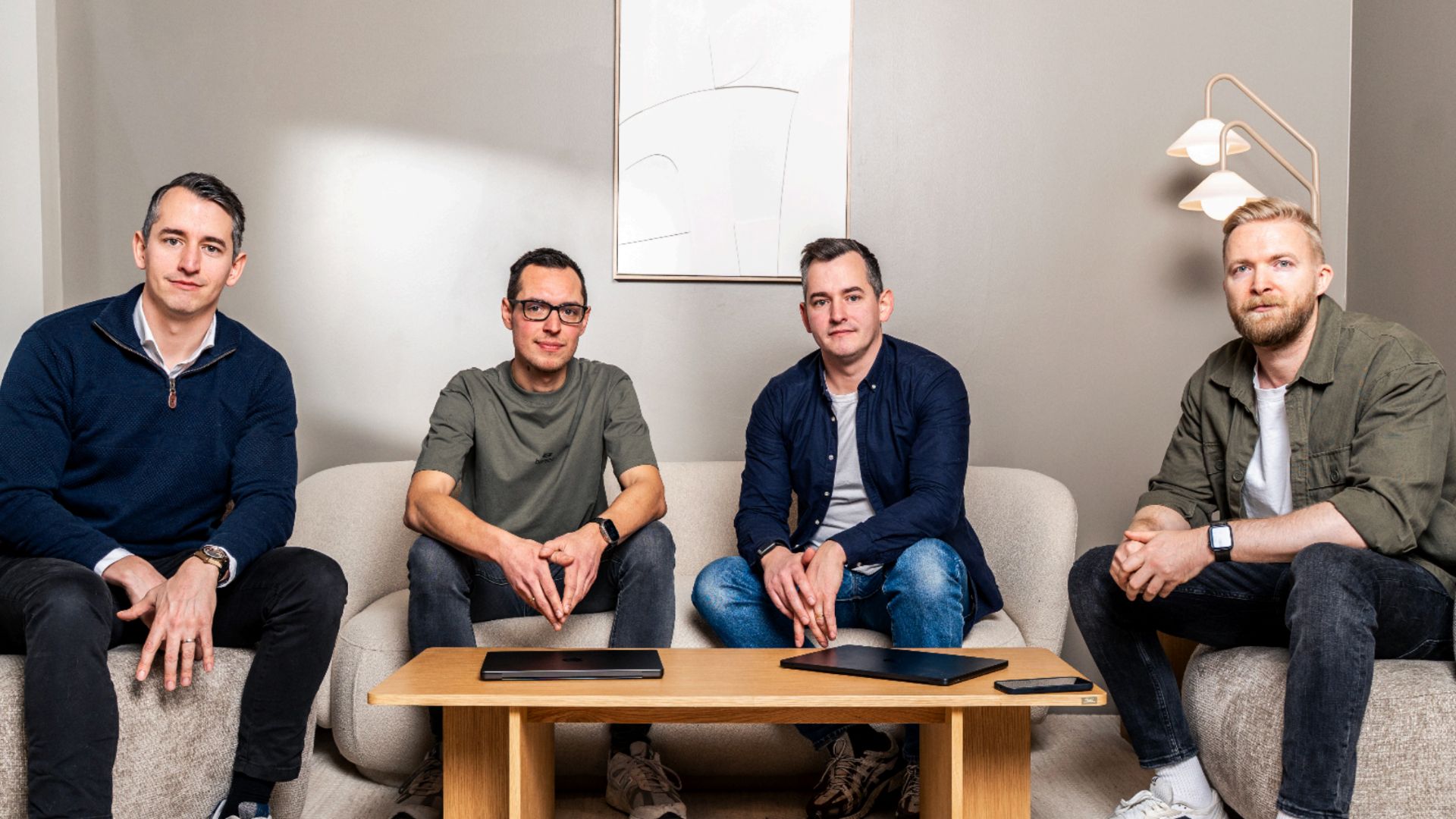 Velatir's four founders seated in an office