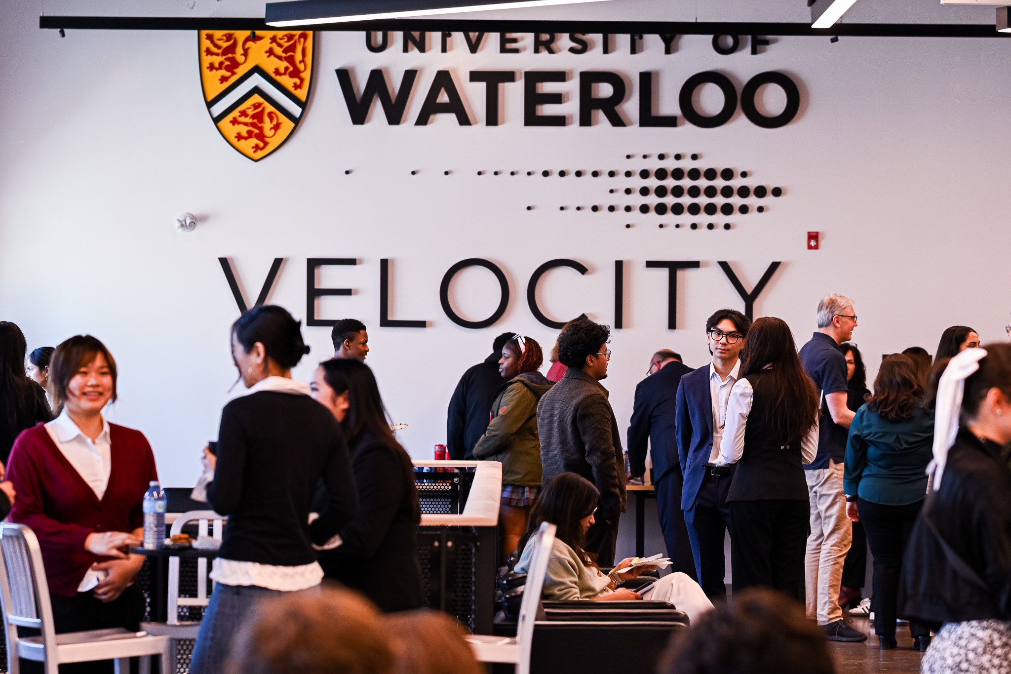 Students and founders talking inside the Velocity Innovation Arena