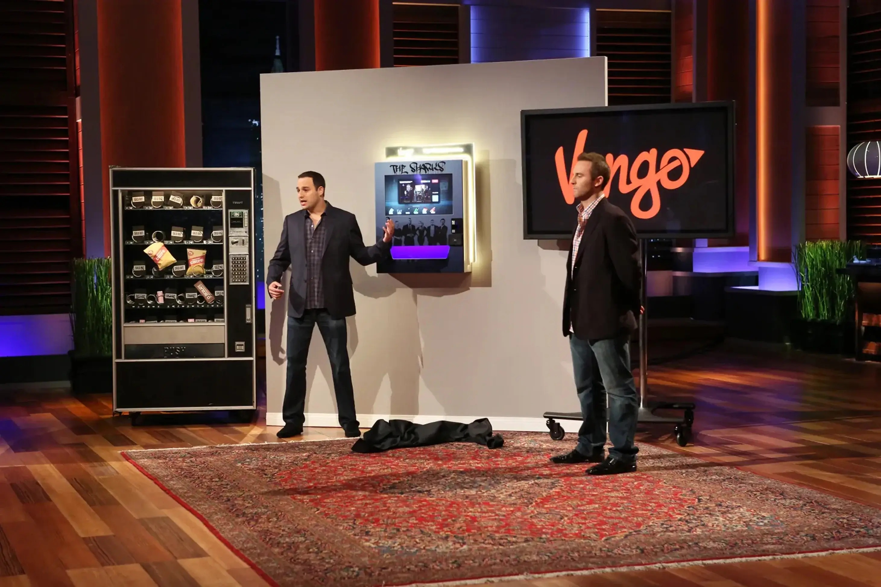 Vengo founders demonstrate a compact wall-mounted kiosk beside a conventional vending machine on Shark Tank