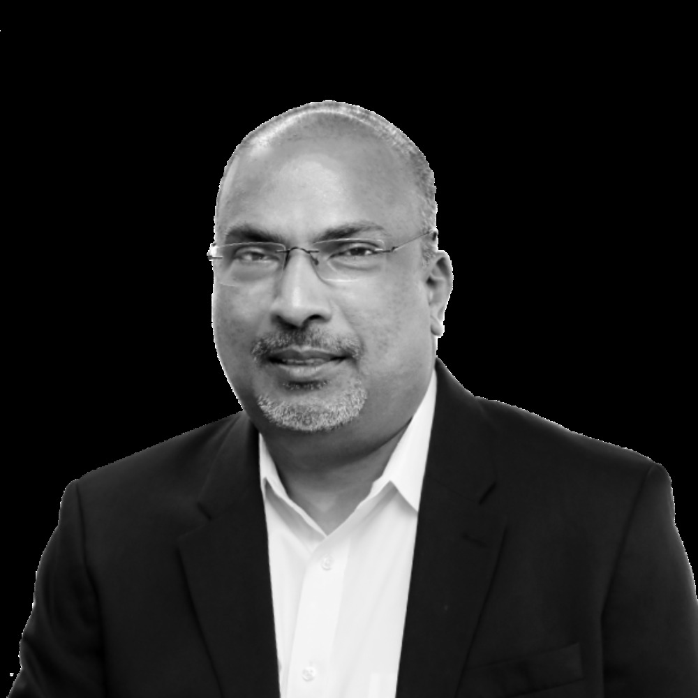 Black-and-white portrait of Venky Yerrapotu in a dark jacket and light shirt