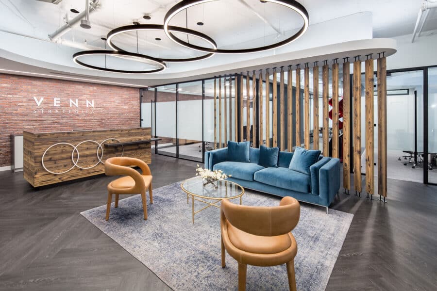Venn Strategies reception area with three circular ceiling lights and a three-ring reception desk