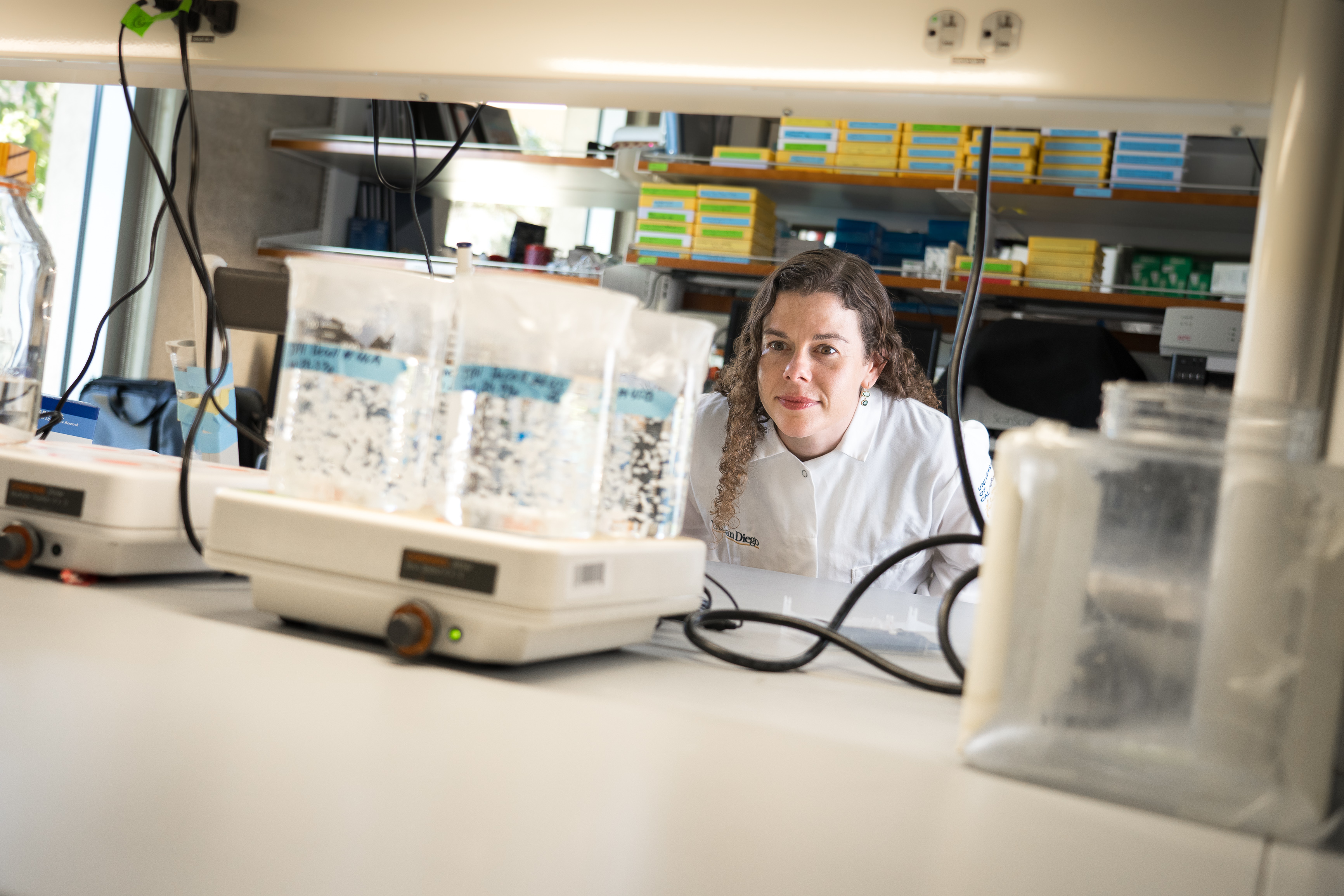 Ventrix scientific co-founder Karen Christman examining materials in a UC San Diego laboratory