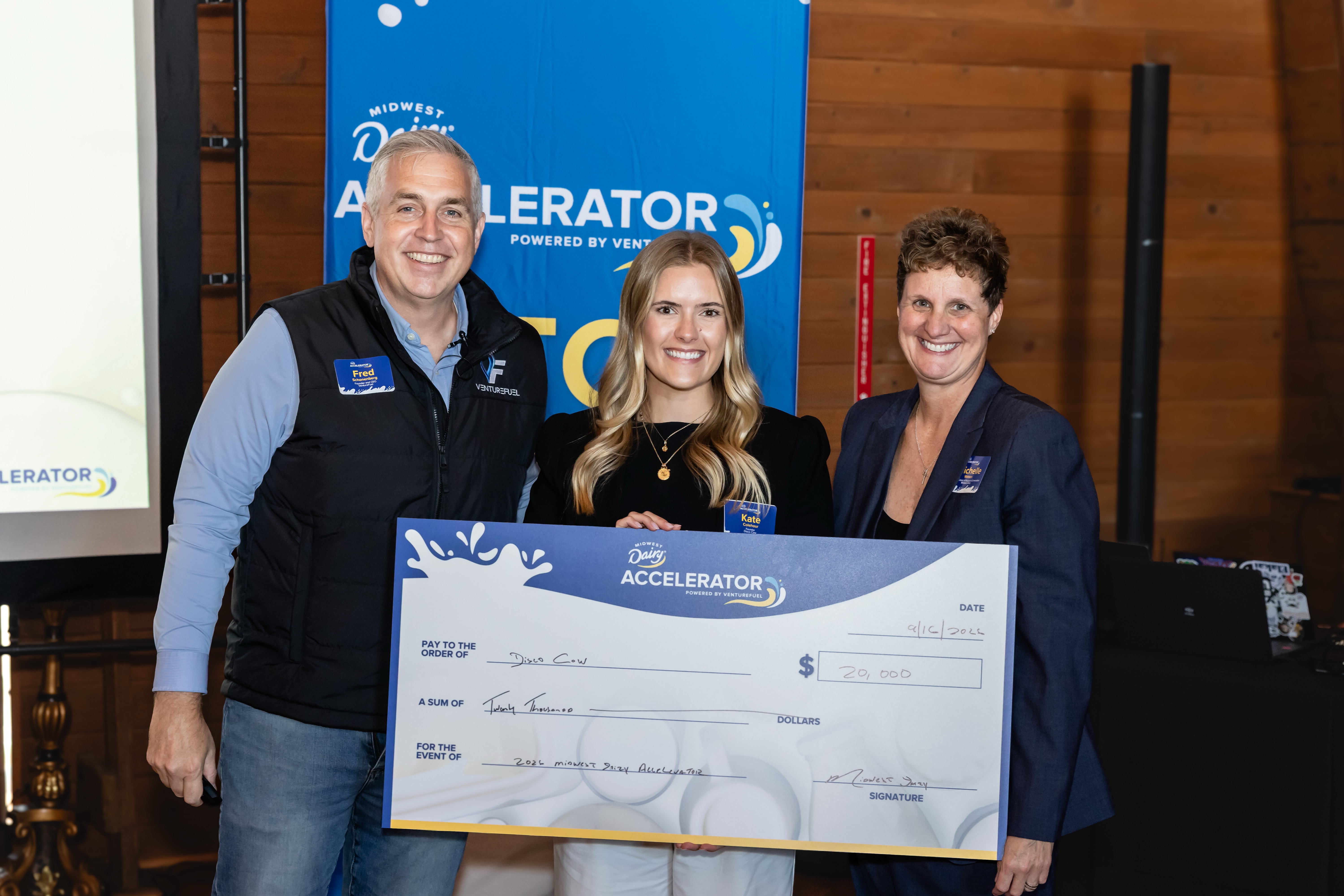 Fred Schonenberg, Disco Cow founder Kate Colehour and a Midwest Dairy representative at the 2026 accelerator prize presentation
