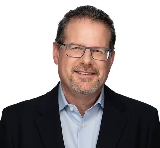 Veracode co-founder Chris Wysopal wearing glasses and a dark jacket