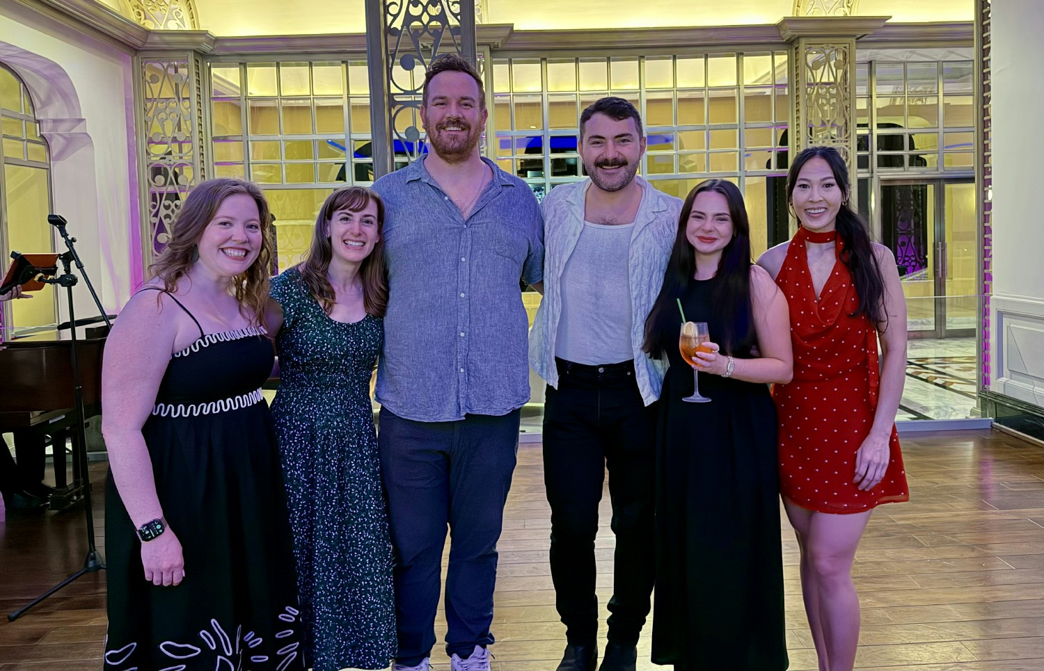 Six members of Vereigen Media’s client-success team posing together at a gathering