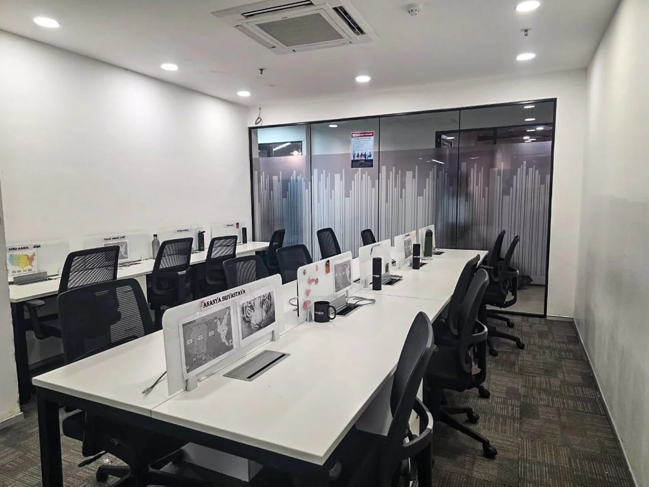 Rows of desks and monitors in the Noida office shown by Veridic Solutions
