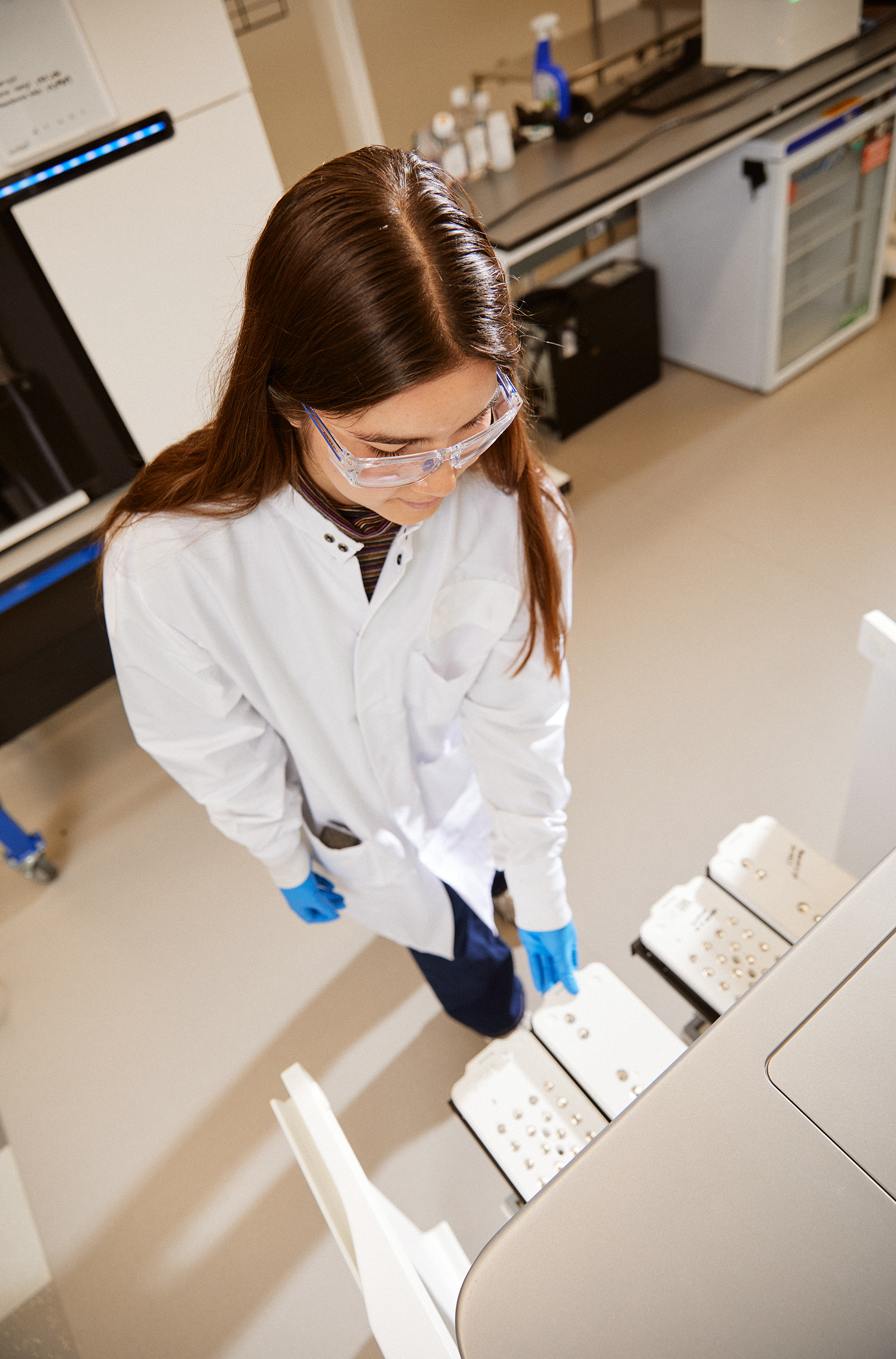 A Verily scientist works with laboratory equipment