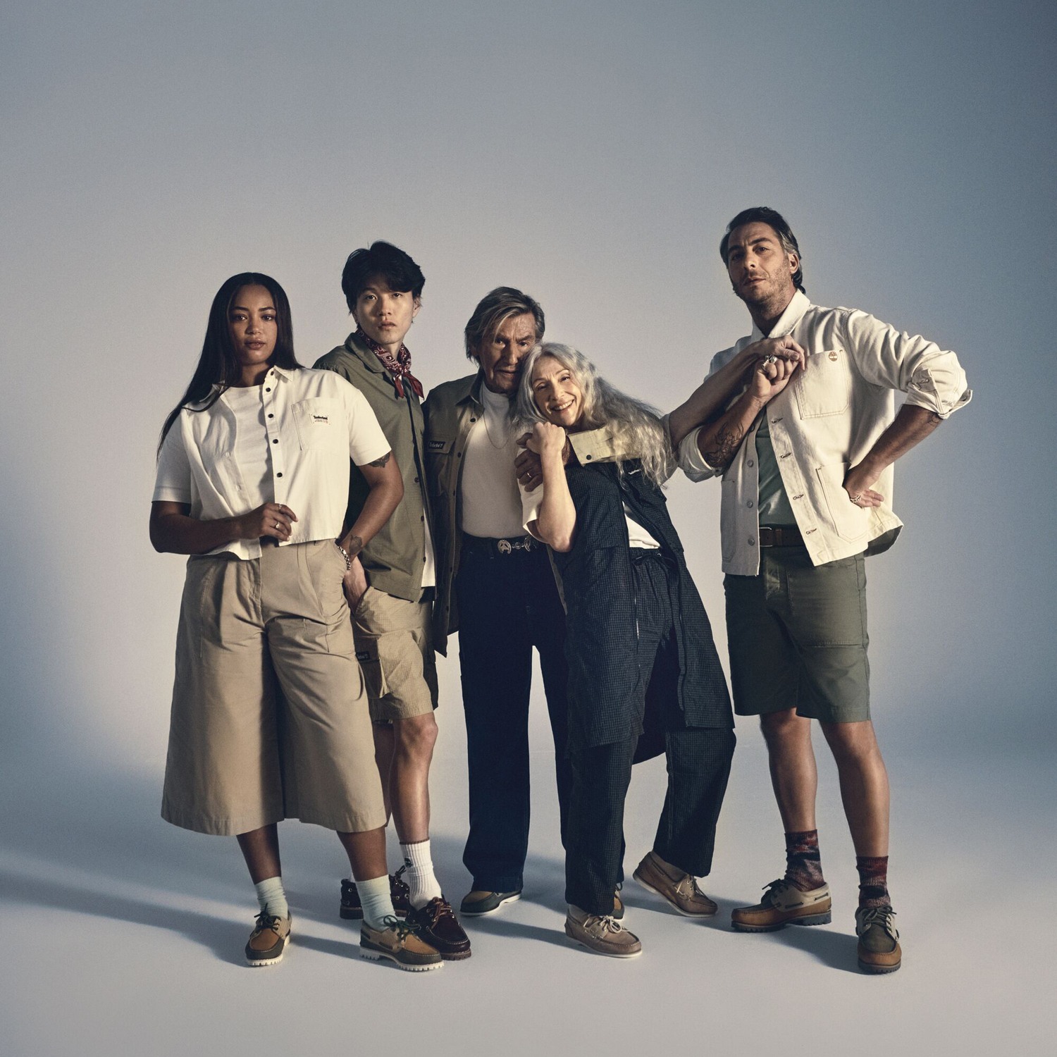 Five people modeling Timberland clothing and footwear