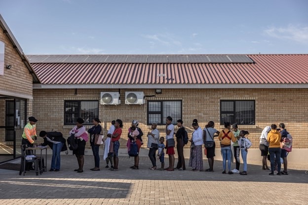 Patients queue outside the Rhiza Babuyile clinic in Diepsloot, South Africa
