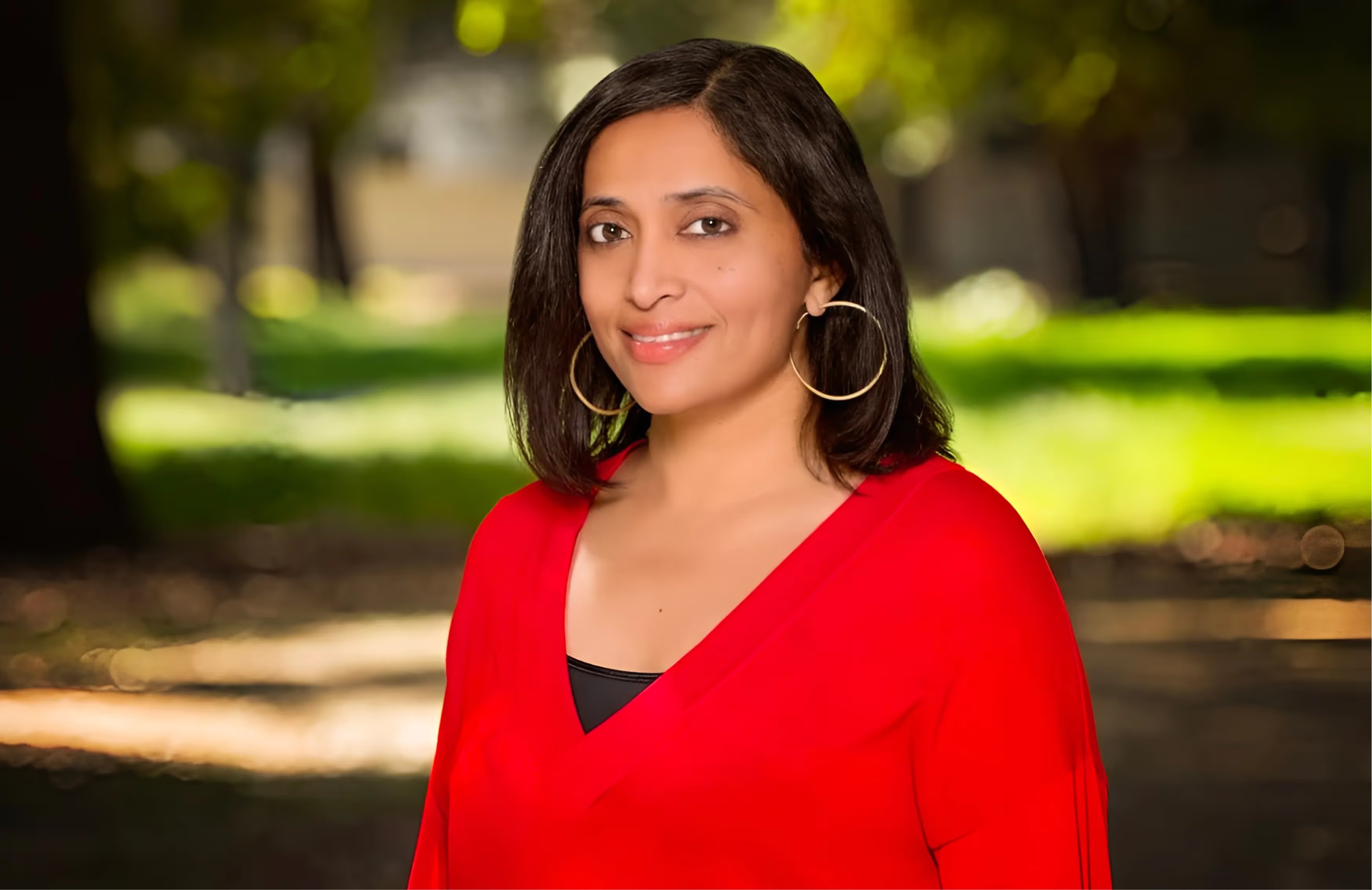 Vidya Narayanan outdoors in a red jacket