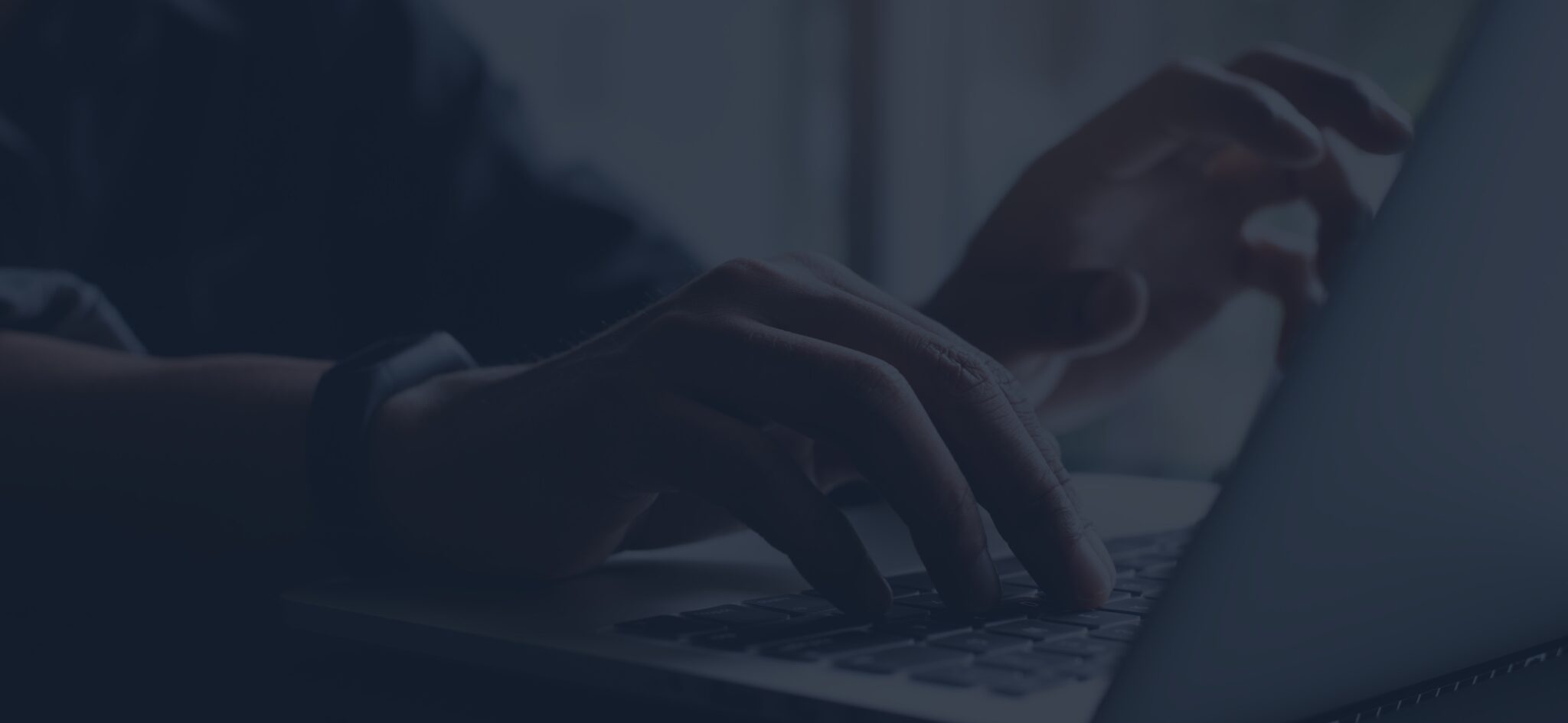 Hands working at a laptop in Viewpost's dark blue visual style