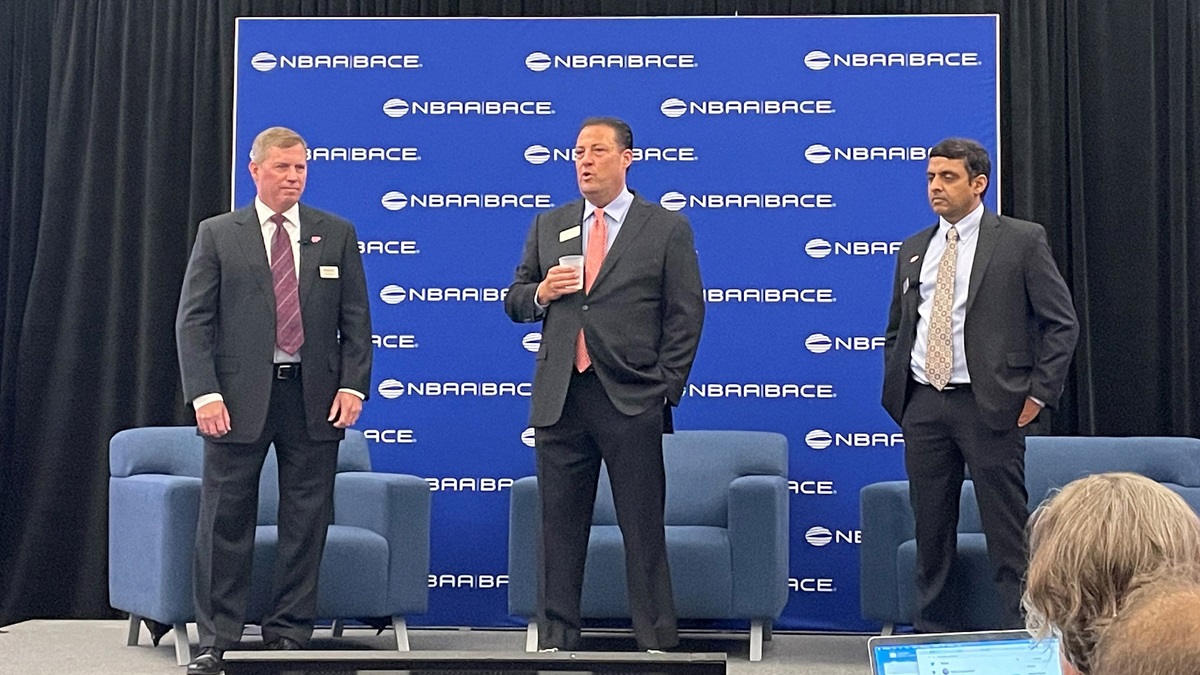 Tom Bergeson, Kenny Dichter and Vinayak Hegde at an aviation convention in Las Vegas