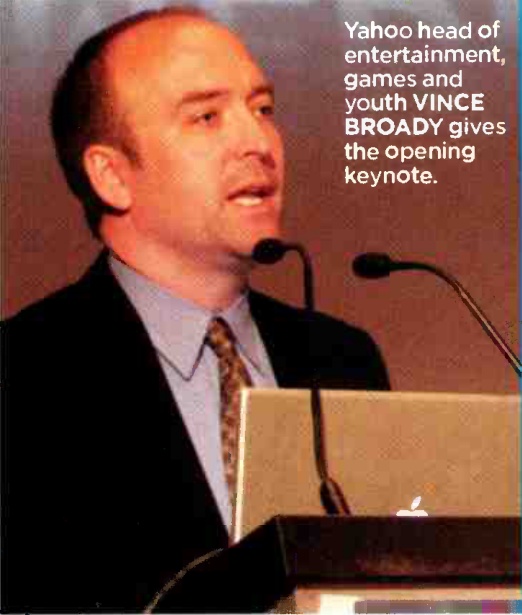 Vince Broady speaking at a conference podium in 2006