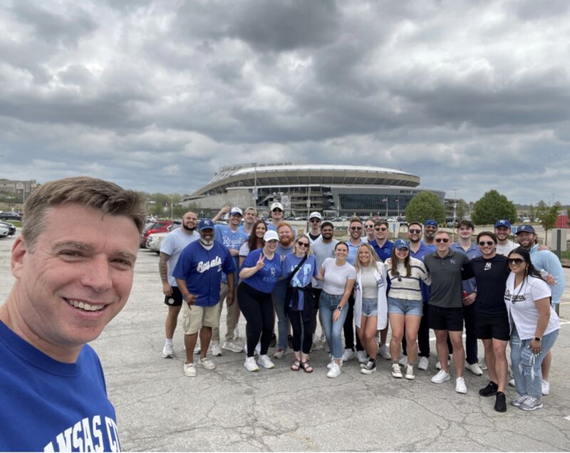 Vince Koehler taking a group selfie with former Netsmart colleagues outside a Kansas City stadium