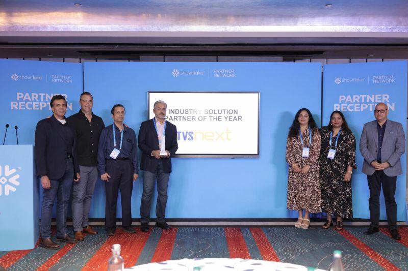 Vinod Krishnan holding an award with colleagues and Snowflake representatives at a partner reception in Bengaluru