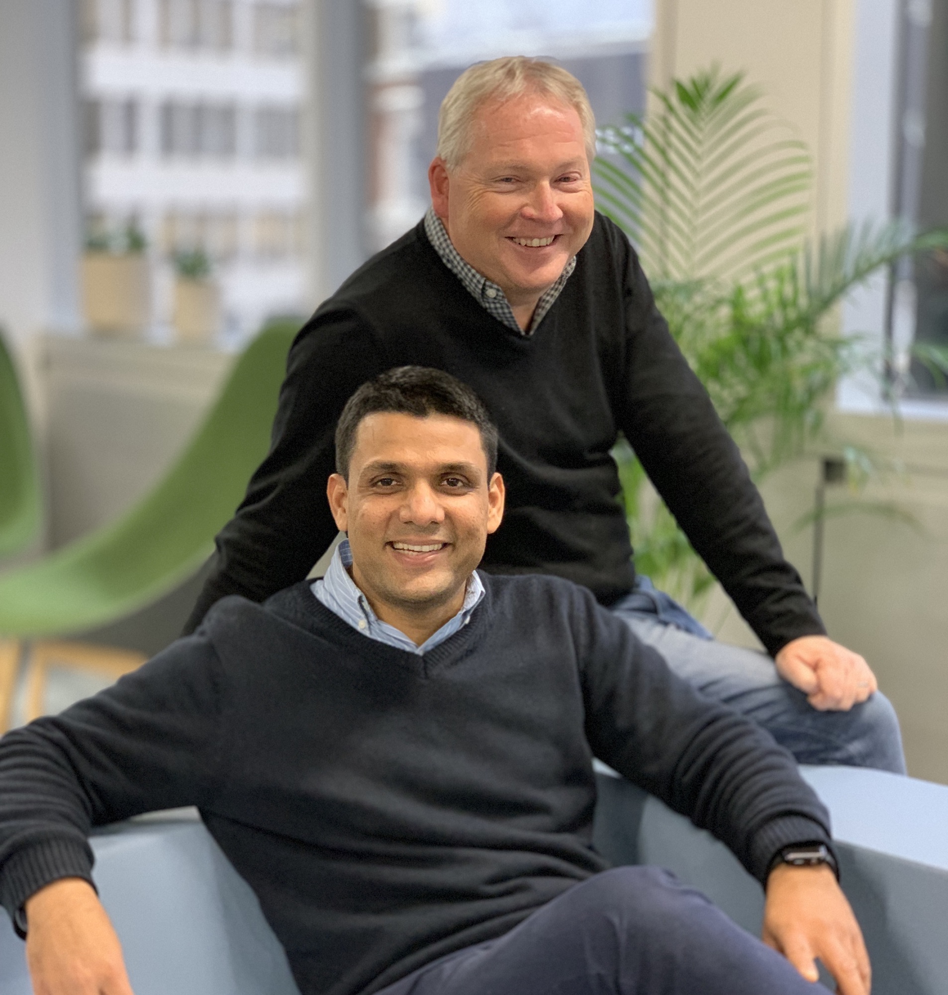 Vipul Mishra seated in front of fellow Neotas co-founder Ian Howard