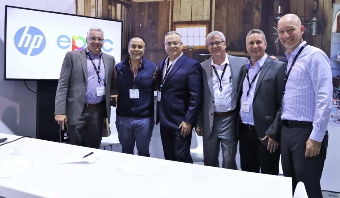 Virag Patel, second from left, with five HP executives at the 2022 press-order event