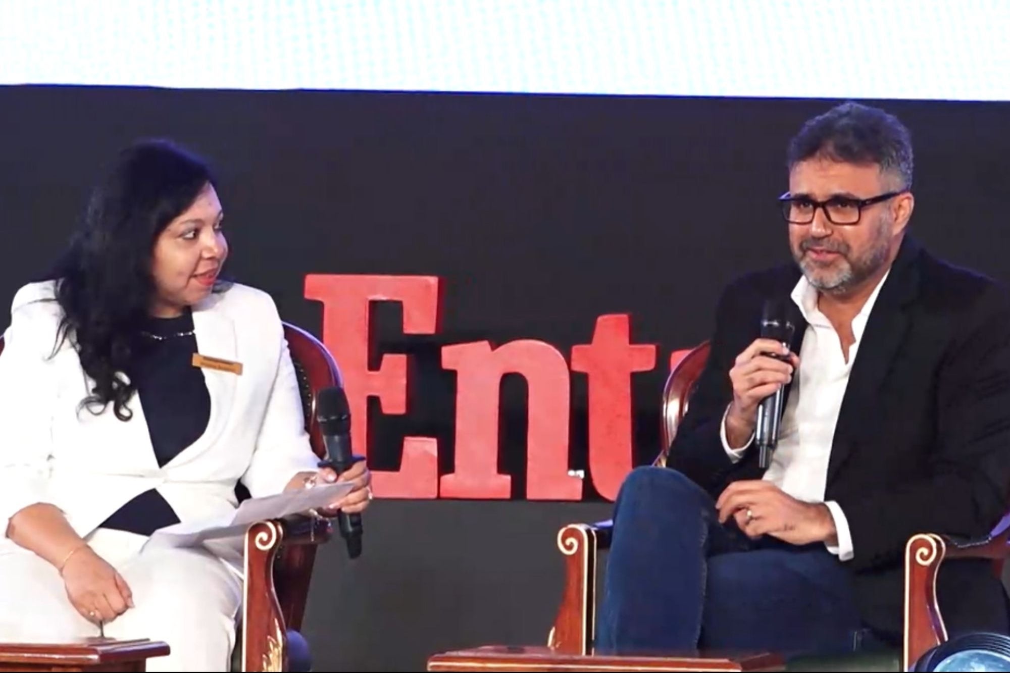 Punita Sabharwal interviewing Viraj Bahl on stage at Entrepreneur Summit 2025