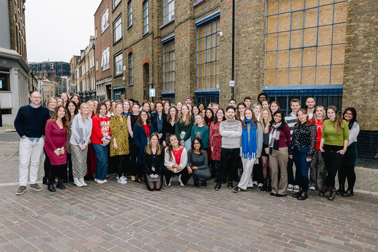 Virgo Health team assembled outside a brick building in London