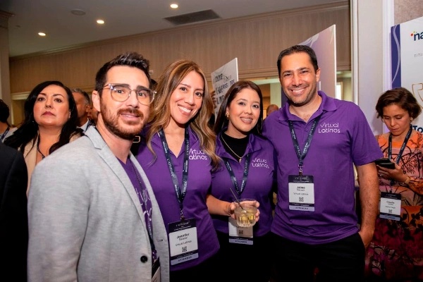 Virtual Latinos team members, including founder Jaime Nacach, gathered at an event