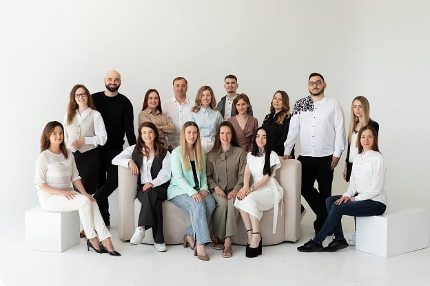 Viseven team members gathered for a studio group portrait