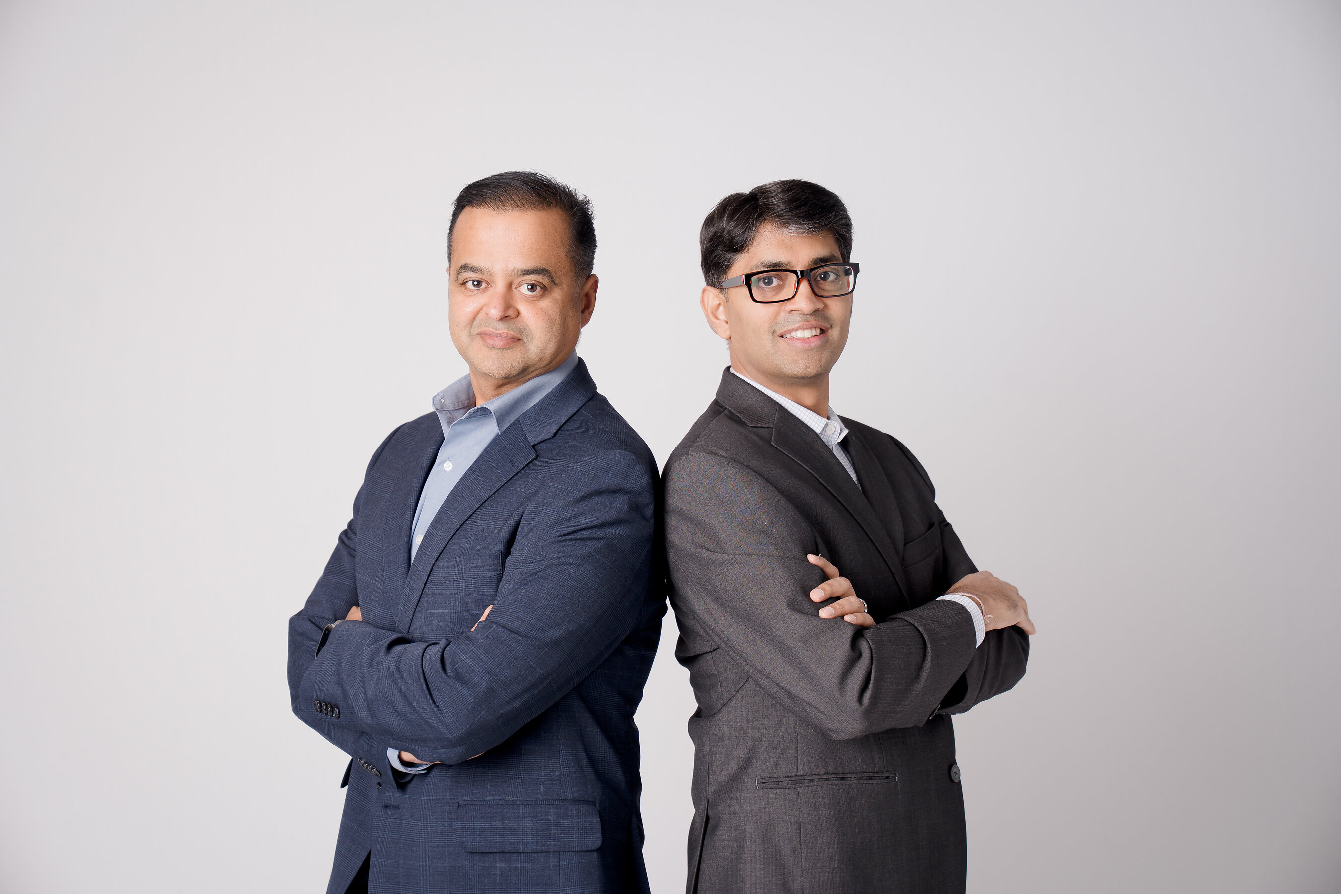 Vishal Sankhla, left, and co-founder Anshu Jain standing back to back