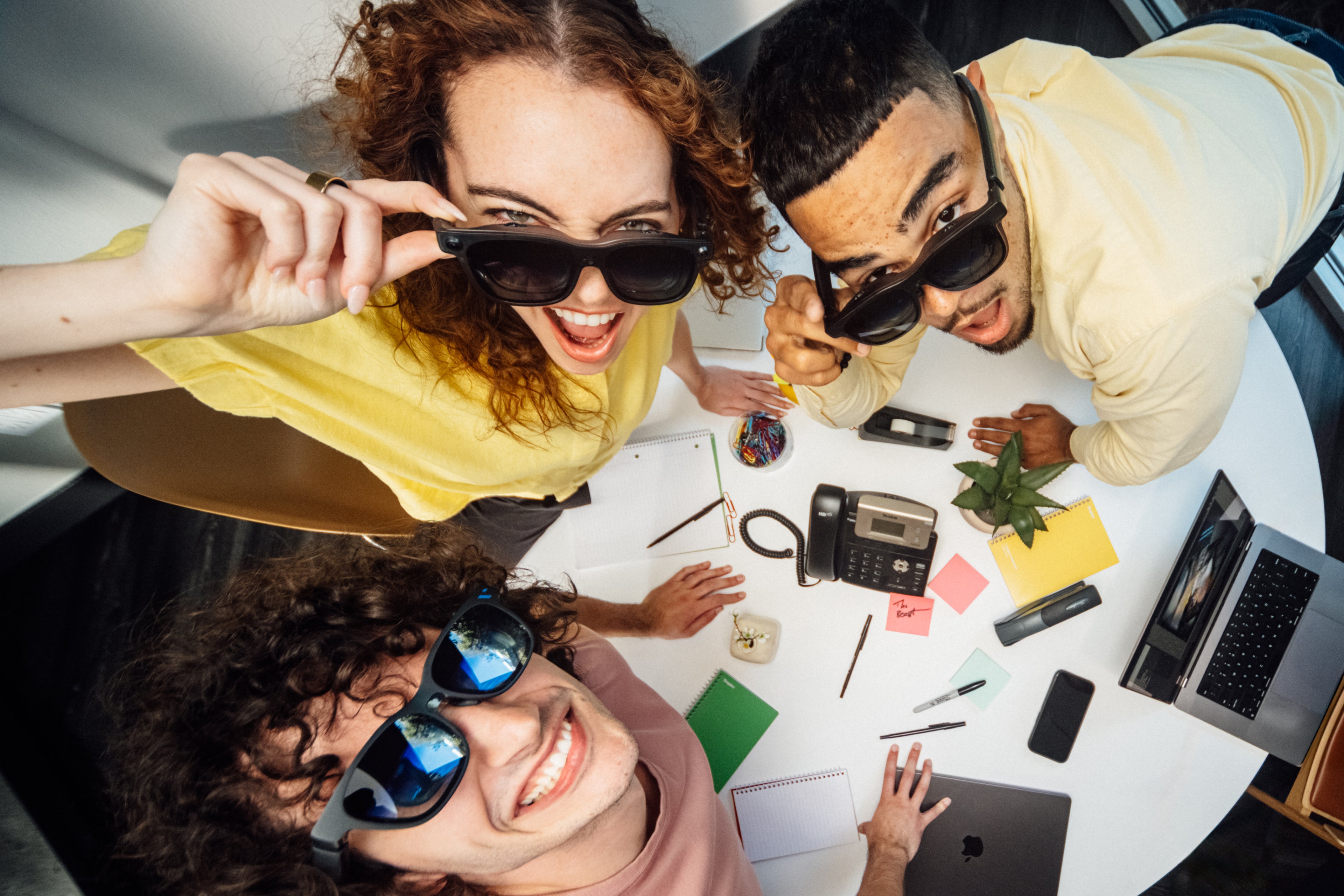 A group wearing VITURE Beast XR Glasses around an office table