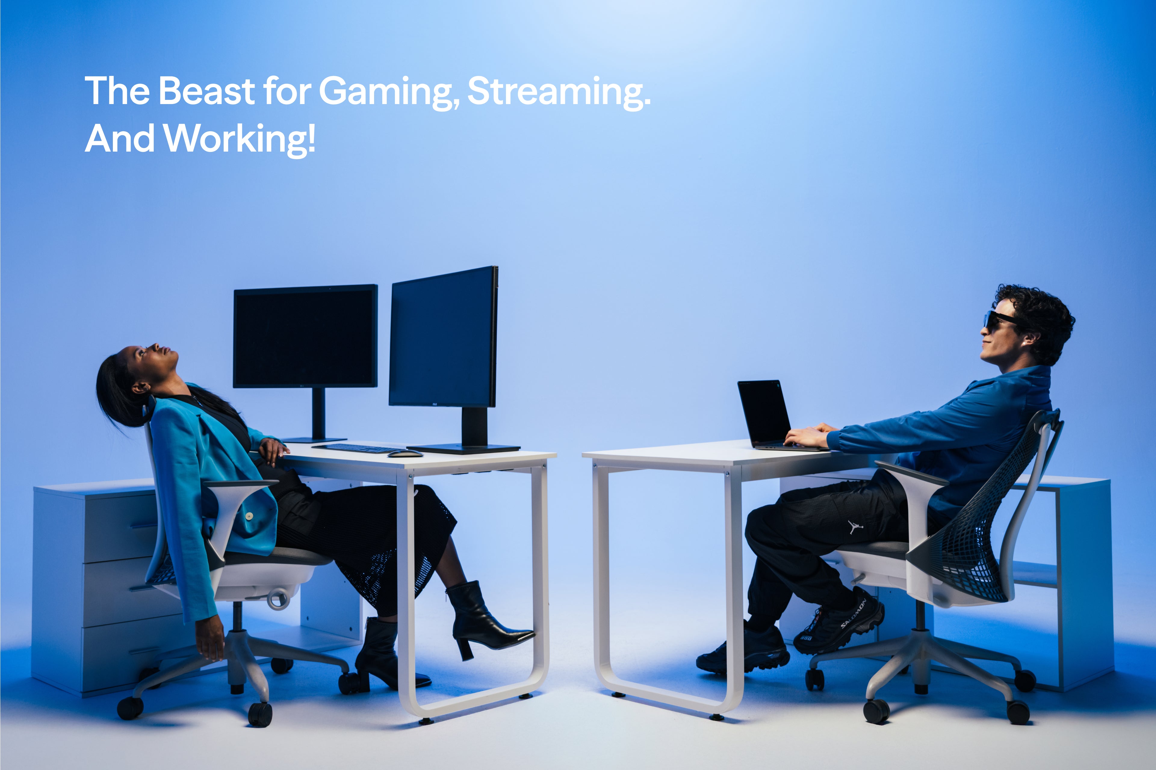 VITURE Beast XR Glasses worn beside traditional monitors in a blue office scene