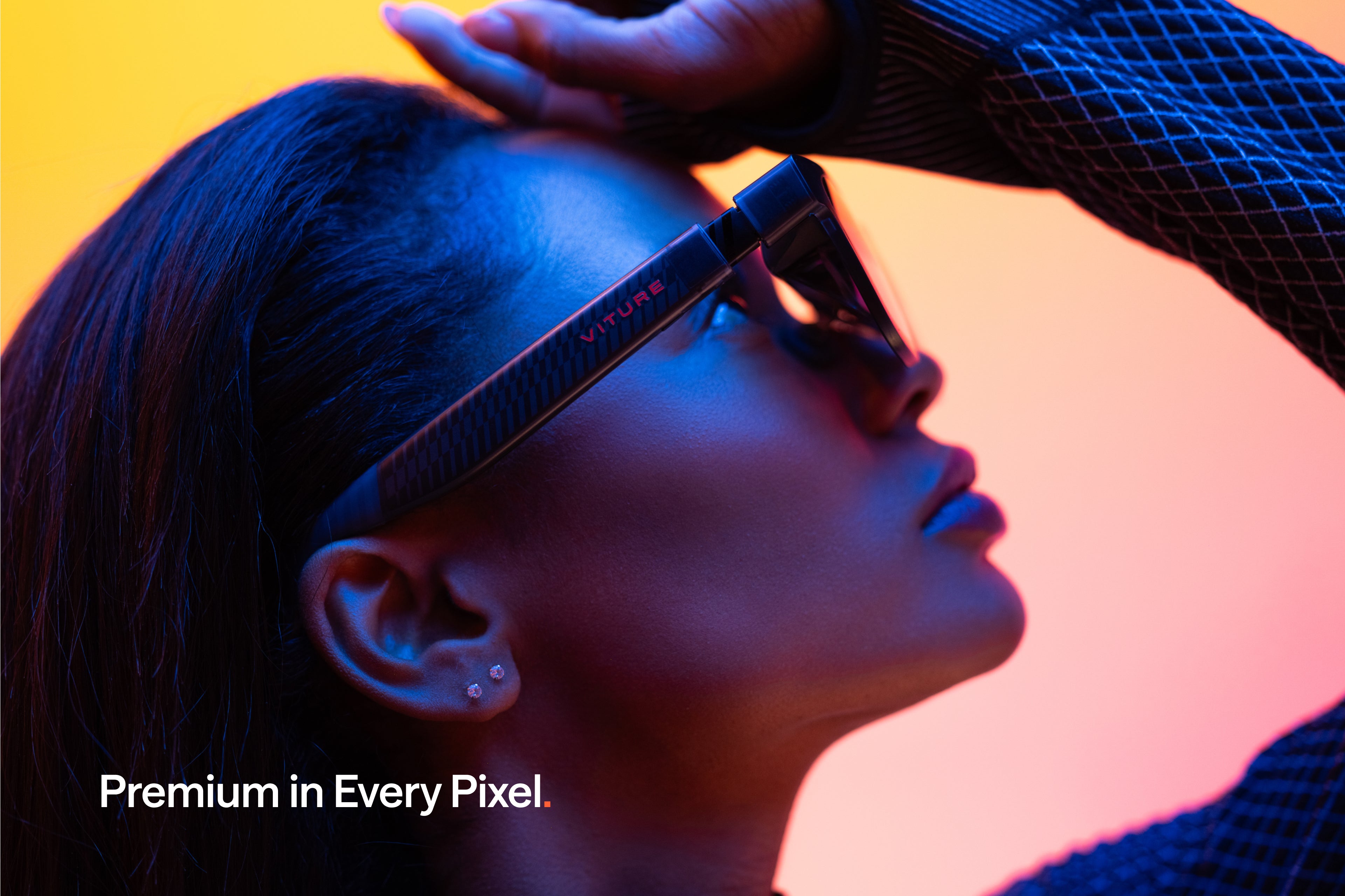 A person wearing the translucent black VITURE Luma Pro XR glasses