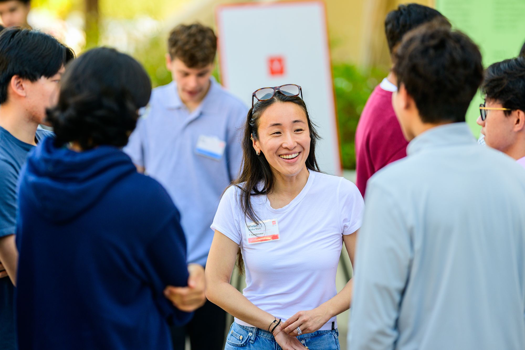 Vivian Midha Shen in conversation with a group at a Y Combinator event