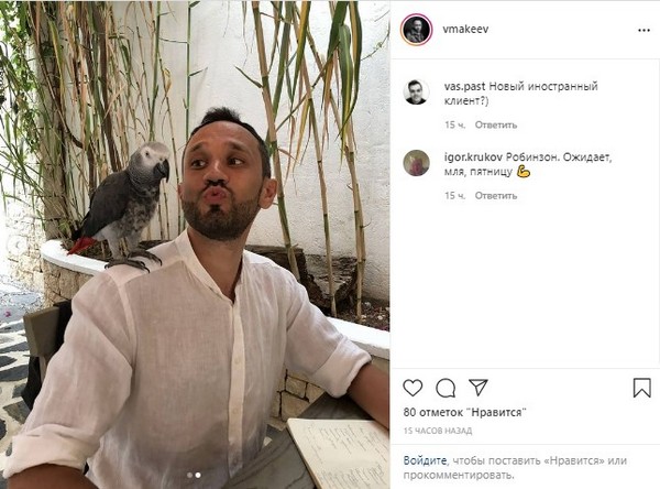 Vladimir Makeev posing with a parrot in a screenshot of his Instagram post