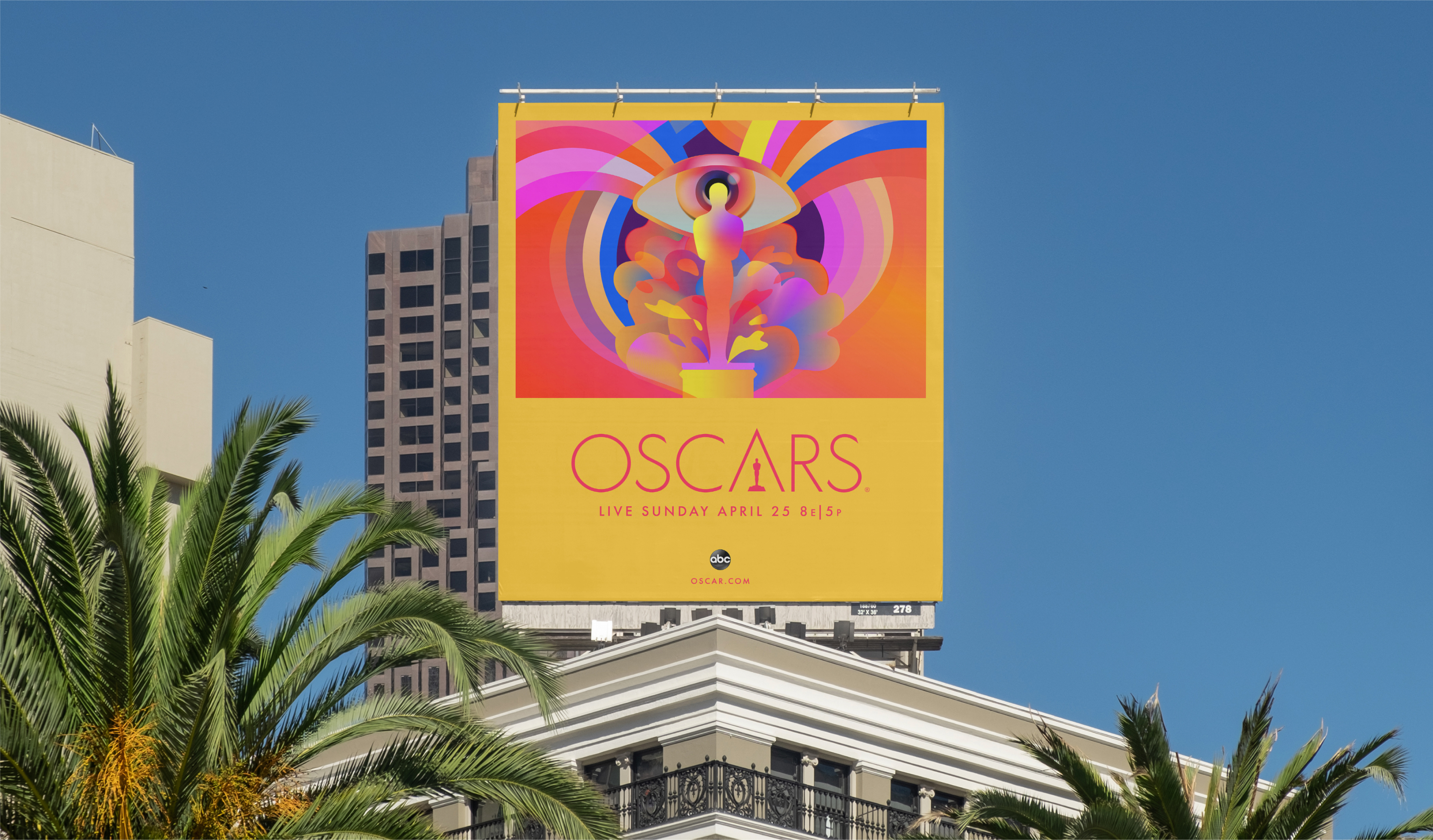 A colourful 93rd Oscars campaign billboard above a street and palm trees