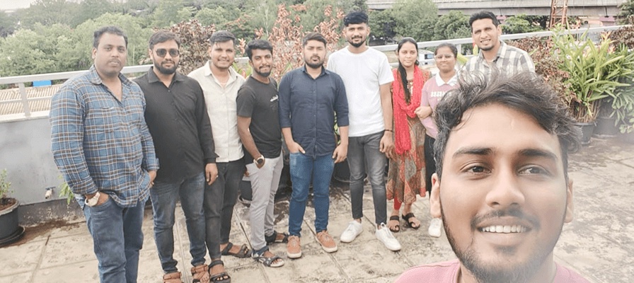 VTEST colleagues posing for an outdoor group selfie