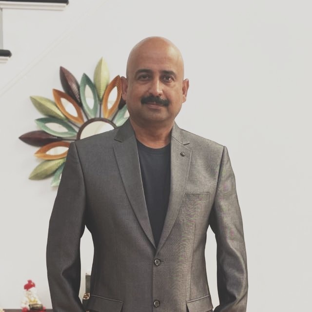 VySystems founder and chief strategist Ramesh Santhanam standing indoors