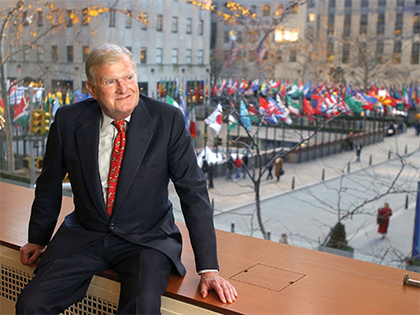 Founder Wm. Polk Carey seated in the former Rockefeller Center headquarters