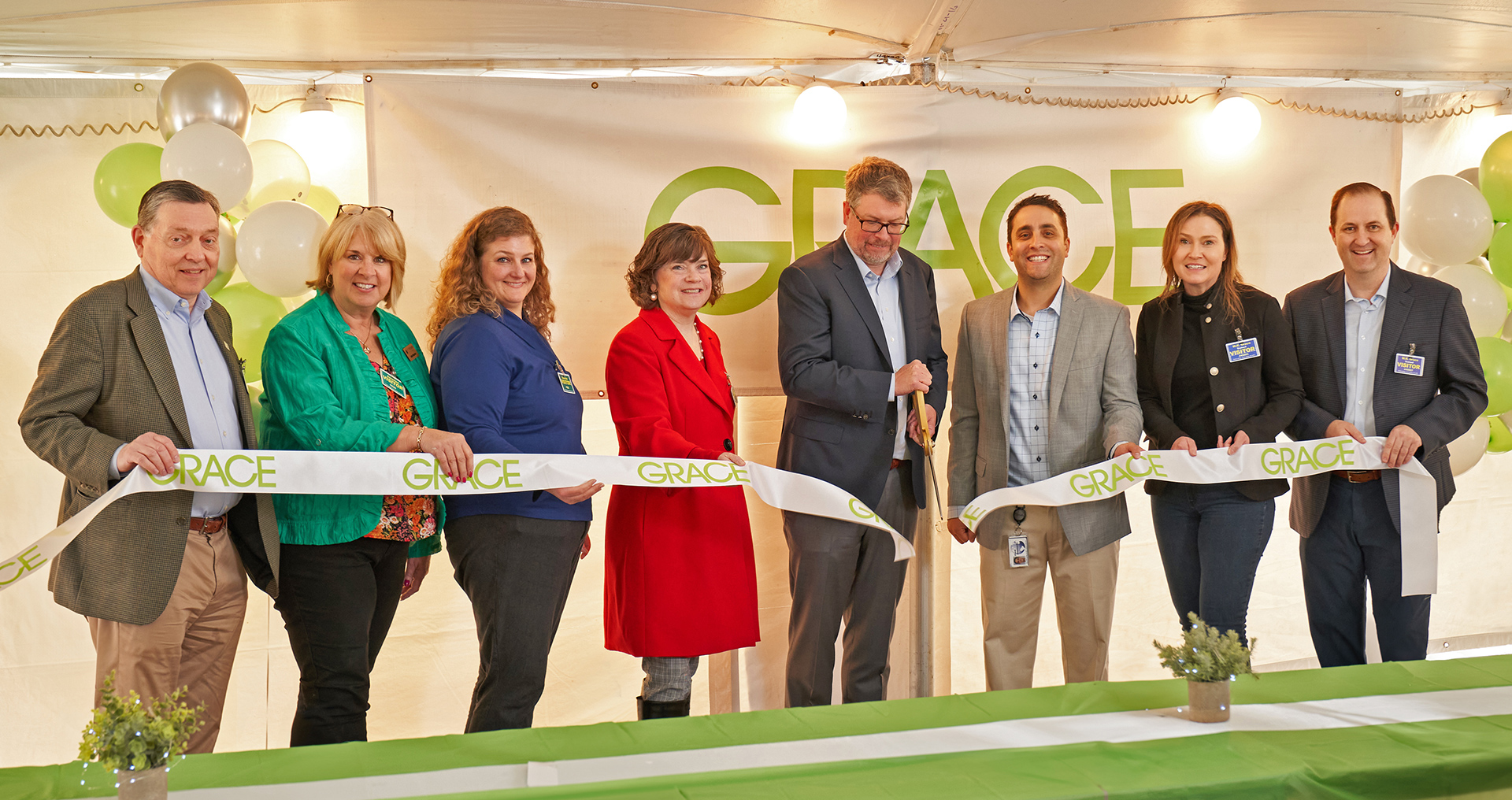 Ed Sparks and Grace colleagues with community leaders cutting a ribbon at the South Haven facility