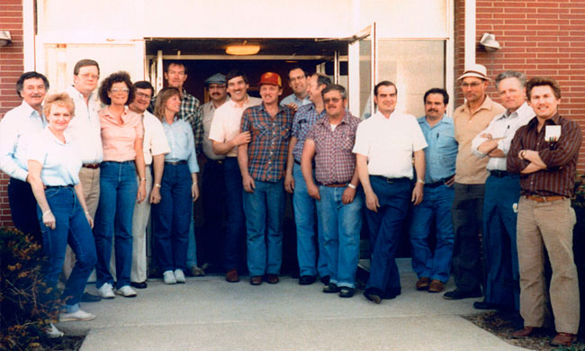 Wabash’s 1985 team gathered outside a brick building