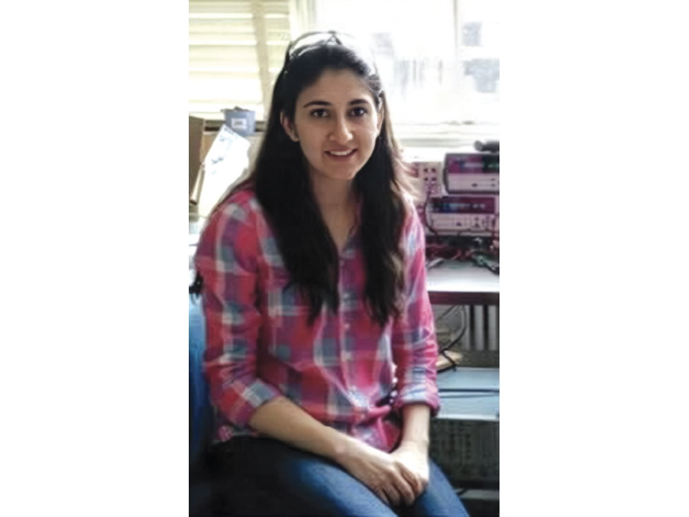 Wardah Inam at a research workbench at MIT