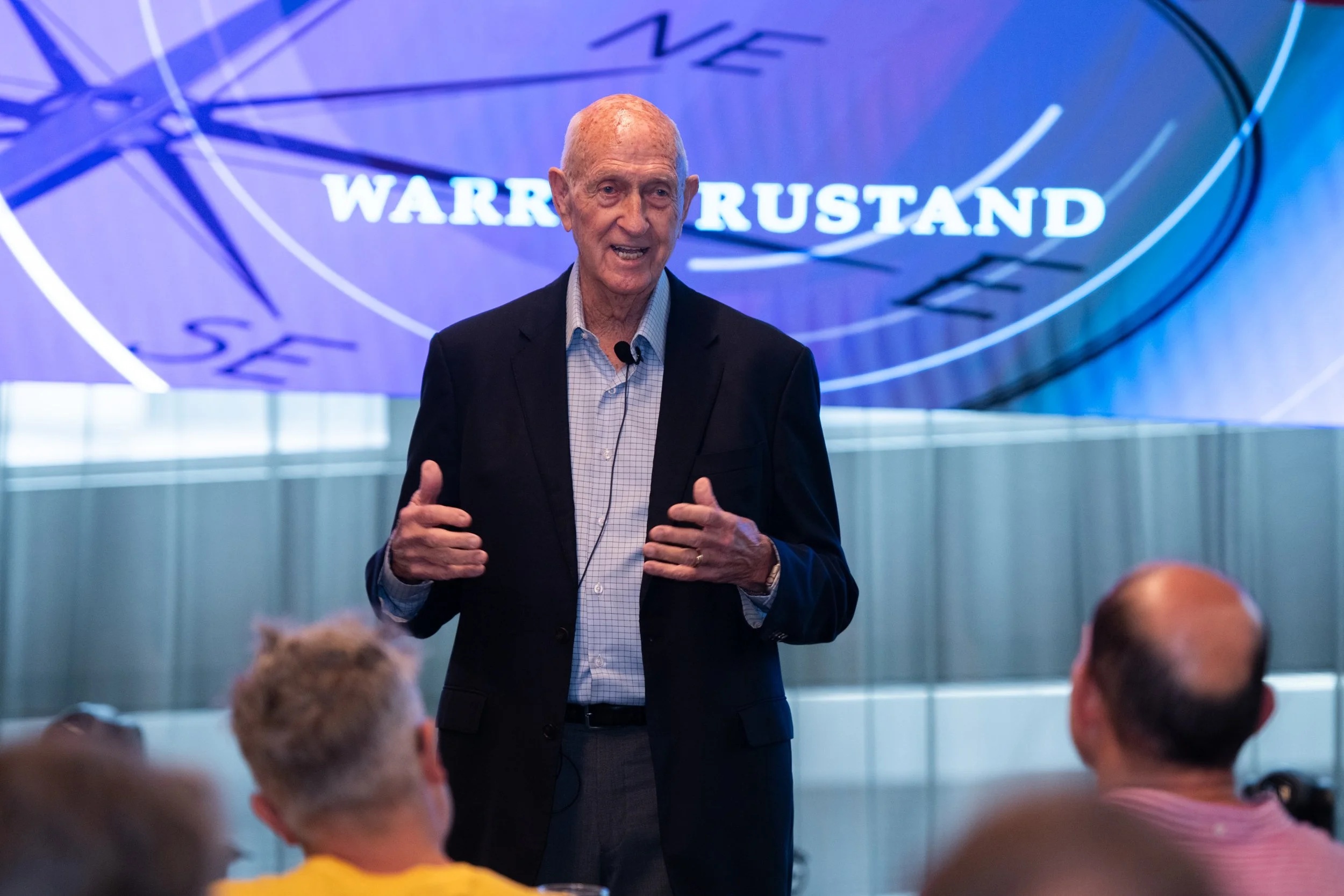 Warren Rustand speaking to seated entrepreneurs at an EO Melbourne event