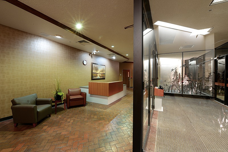 WAUSAU’s remodeled lobby in 2015, with a reception desk and steel artwork