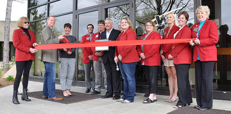 A group gathered outside WAUSAU’s office for the 2015 ribbon cutting