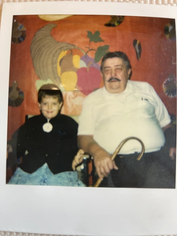 A childhood family photograph of Wayne Stanley with his grandfather, Glen Bowe